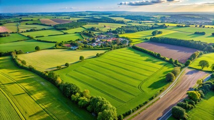 Fototapeta premium Aerial view of lush green fields in Berryfields, Aylesbury, England on a sunny day , countryside, aerial view