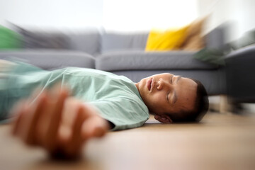 Close Up of Man Hands Who has a Vertigo Disorder Fainting on The Floor Feeling Spinning Head