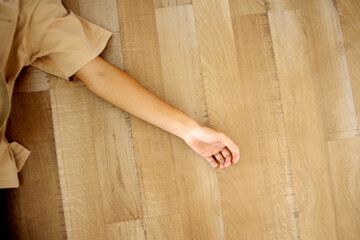 Top View of Person Hands Fainting And lying on The Floor