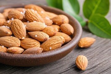 Delicious roasted almonds in a wooden bowl