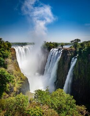 Fototapeta premium Majestic Waterfalls of Victoria Falls, Where Africa's Zambezi River Roars