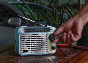 Hand turning on a stereo player