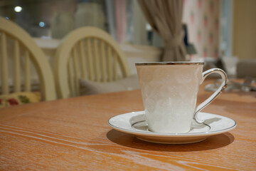 White coffee and tea drinking glasses are on the table.