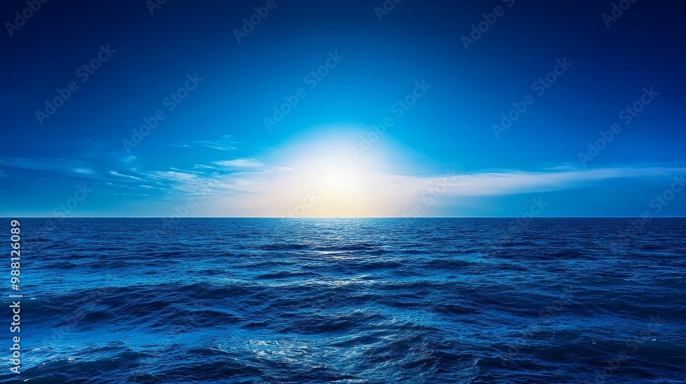 Aufkleber a serene and calming view of a vast ocean with soft rolling waves and a brilliant sunset on the hori