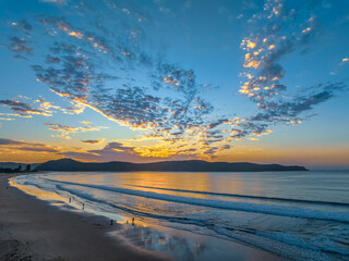 Sunrise seascape with pretty clouds in the sky