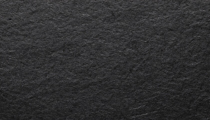Grainy black paper texture macro close up view