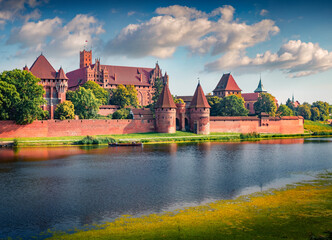 Breathtaking summer cityscape of Malbork town on the Nogat River, Pomeranian Voivodeship,  Poland,...