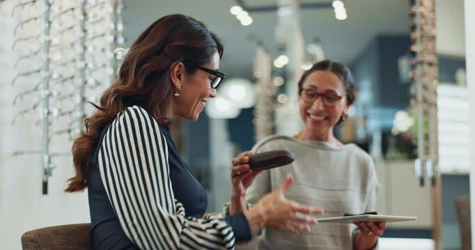 Happy woman, glasses and optometrist with customer at store for eye care, vision correction or fashion. Client, smile and try spectacles for choice, help or advice with lens prescription for health