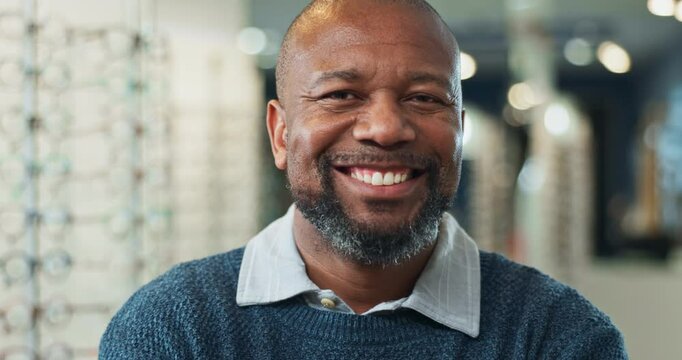 Face, smile and welcome with optometry black man in eyewear store for checkup or consultation. Assessment, portrait and smile of mature person in optometrist clinic for healthcare, service or vision