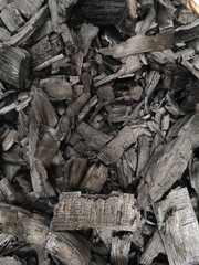 Wood chips, wood charcoal, old wood charcoal that has been burned to black, black wood charcoal.