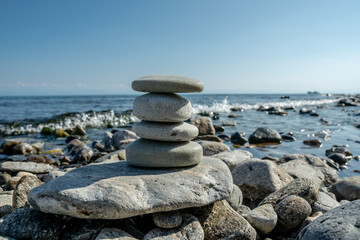 Handmade craft soap in the shape of stones on the seashore or lake. The image of organic cosmetics in the natural environment