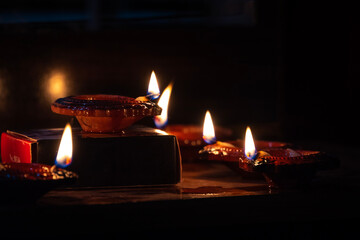 Happy Diwali - Beautiful diwali diya lamps lit during diwali celebration. Indian festival diwali