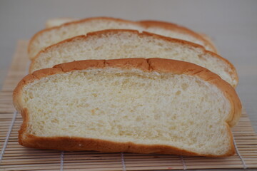 Sliced bread on a bamboo mat 