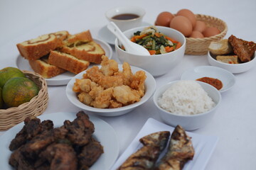 traditional Indonesian food arranged neatly on a white surface