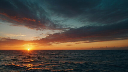Sunset in front of the clouds the sky is over the salt water ocean