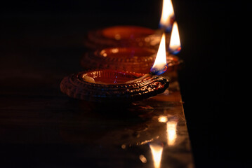 Happy Diwali - Beautiful diwali diya lamps lit during diwali celebration. Indian festival diwali