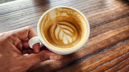 Top view latte art coffee on wood background