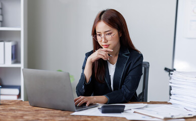 Business financing accounting banking concept. Business woman hand doing finances and calculate on desk about cost at home office. Woman working on desk with using calculator, finance accounting.
