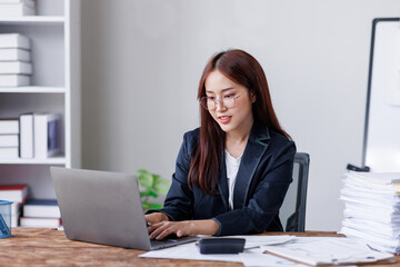 Business financing accounting banking concept. Business woman hand doing finances and calculate on desk about cost at home office. Woman working on desk with using calculator, finance accounting.
