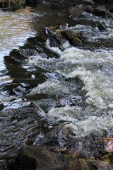 beautiful stream over the rocks in the mountains