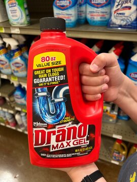 Red bottle of Drano Max Gel drain opener and cleaner solution.
