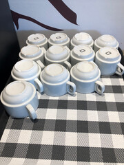 The cups on the tray are turned upside down.