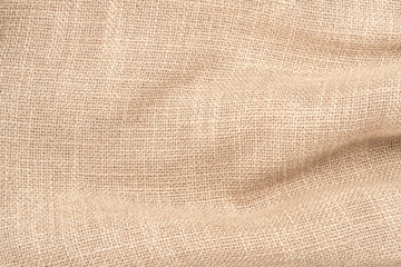 Jute hessian sackcloth woven burlap texture background in sepia cream old aged brown color