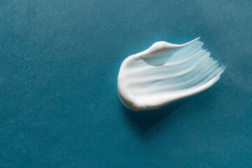 A smear of cream on a light background. Beauty concept.