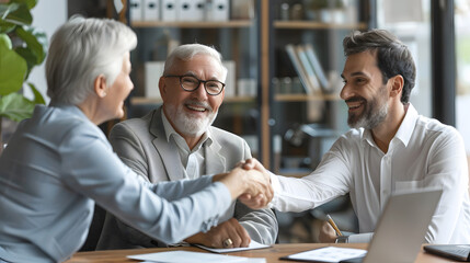 Senior couple, happy old people and realtor handshake deal in office. Helping clients buy, rent home, apartment, male real estate agent assisting buyers in marketing, display real