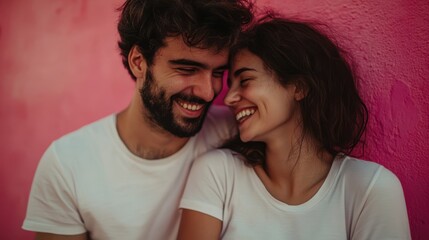Obraz premium Happy Couple Sharing a Connection in Stylish Summer Fashion Against Pink Wall Background