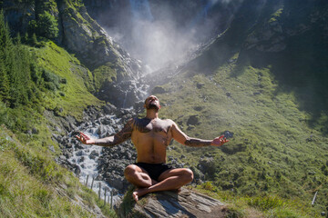 Tourist breathing and relax in nature. Meditation, spiritual wellness. Calm, athlete and freedom in environment. Training mindfulness. Relaxed man in nature. Freedom and happiness lifestyle.
