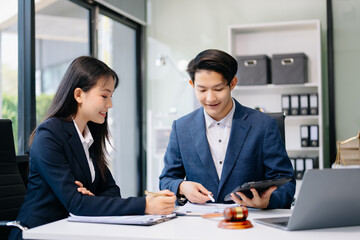 business people and lawyers discussing contract papers sitting at the table. Concepts of law, advice, legal services.
