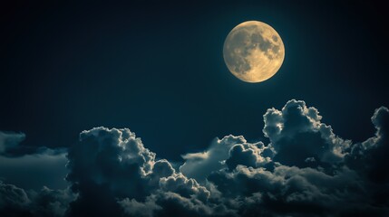 Obraz premium The moon glowing behind the moving clouds