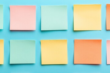 Fototapeta premium Colorful sticky notes arranged on a blue background