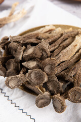 dried lyophyllum decastes on wooden table.