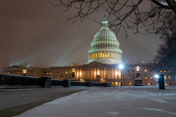 US Washington D. C. in winter night snow. Capitol Building in night. Washington city Capitol. United States Capital. USA landmark. Supreme Court. Washington D.C. Night Washington Capital city.
