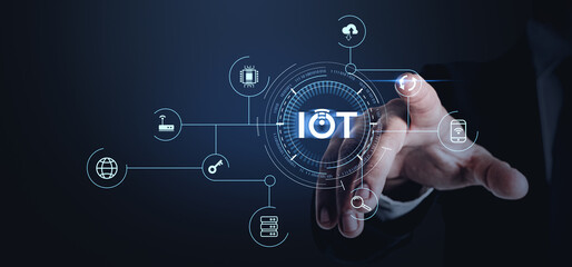 IoT concept with holographic interface and icons on dark background.