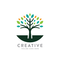 Obraz premium Creative artistic tree logo concept. eco friendly tree logo. Colorful leaf tree logo. minimalist tree vector icon logo