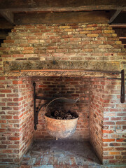 Cast iron cauldron and fireplace
