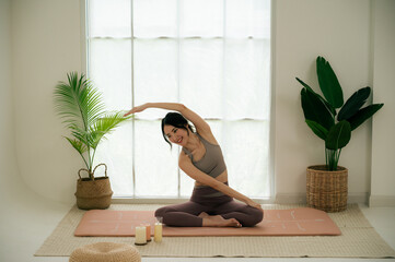 Asian woman yoga routine at Yoga studio