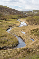 A small stream flowing in the highlands of the Varanger Peninsula National Park, Vardø, Finnmark