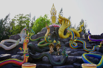 The nine Naga families received blessings for good fortune, work and finances from the Buddha statue in the world-opening posture                         