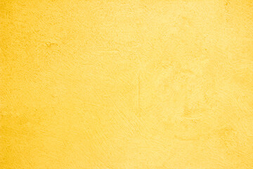 Yellow concrete stone texture for background in summer wallpaper. Cement and sand wall of tone vintage minimal. Concrete abstract wall of light orange color, cement texture white blank for home decor.