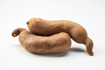 Two sweet potatoes stacked on top of each other