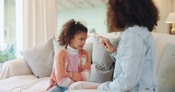 Listen, mother and discipline child in home to stop bad behavior, problem and learning strict rules. Mom, girl and scold for punishment with parent warning naughty kid for mistake, fail or conflict