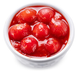 Peeled cherry tomatoes in tomato sauce or juice in white bowl. File contains clipping path.