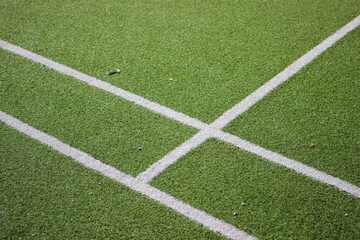 Obraz premium tennis court covered with artificial grass close up