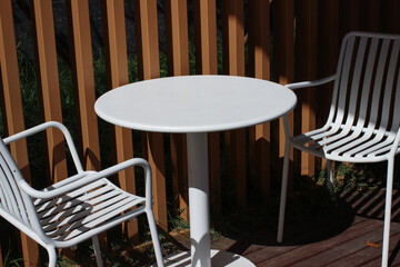 white table and chair for outdoor under shade sunshine