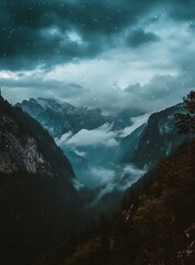 Mountain Range Covered in Fog with Stars Above