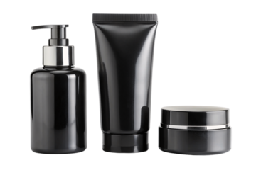A black cosmetic set comprising a pump bottle, tube, and jar, each with a glossy finish, embodying elegance and luxury in packaging, on a transparent background